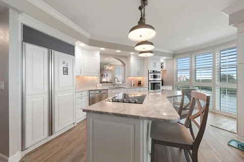 a kitchen with wooden cabinets and a stove top oven