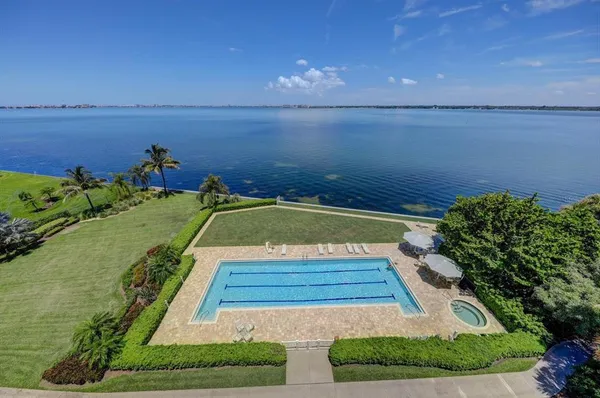a view of a swimming pool with a lounge chair