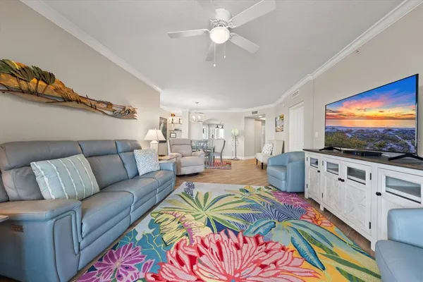 a bedroom with furniture and a large window