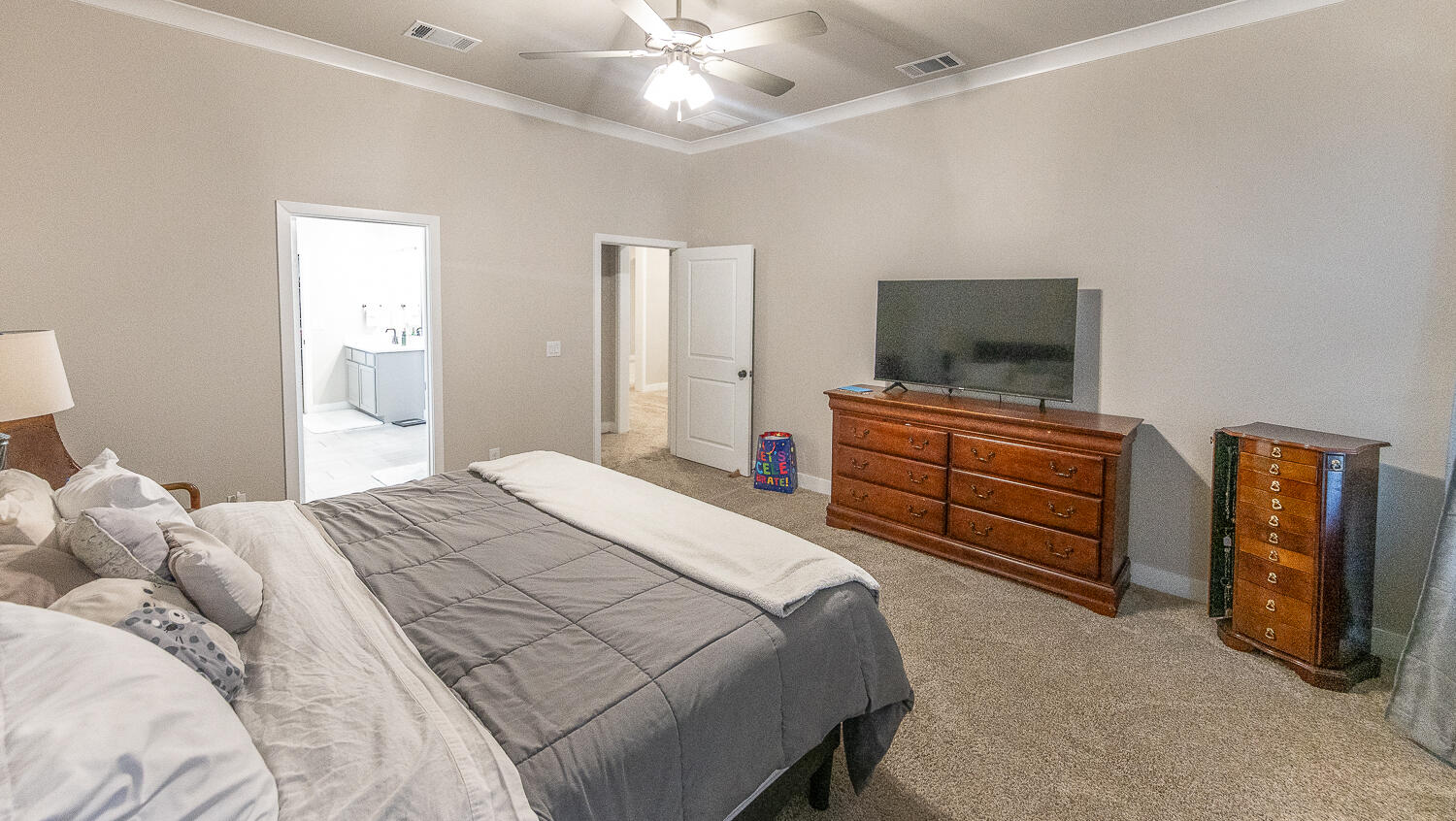 7334 29th Street Lubbock, TX 79407 - Photo 11 of 31 a bedroom with a bed and a television in it