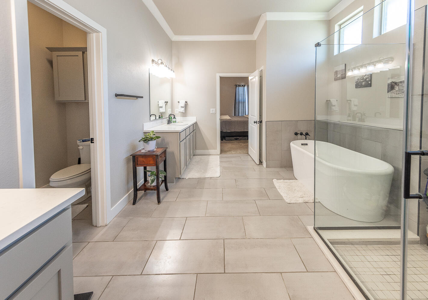 7334 29th Street Lubbock, TX 79407 - Photo 15 of 31 a bathroom with a sink a toilet and shower