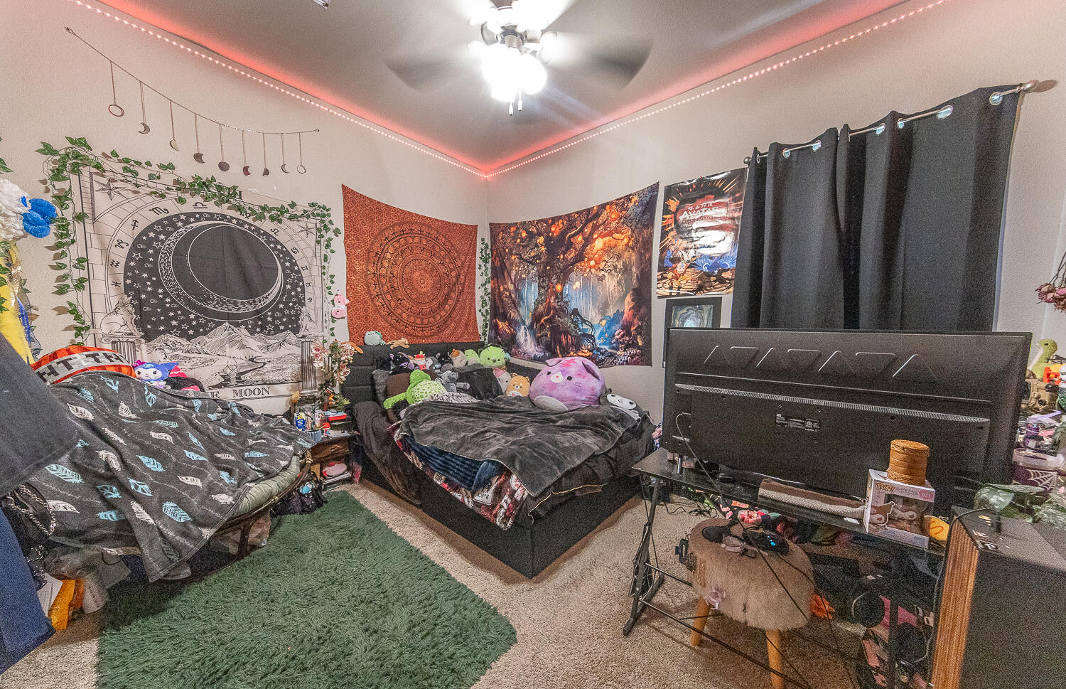 7334 29th Street Lubbock, TX 79407 - Photo 16 of 31 a living room with furniture a flat screen tv and a fireplace