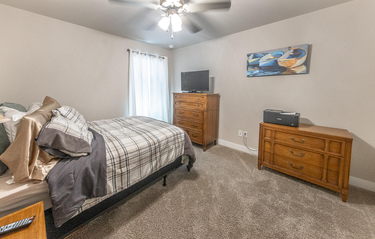 7334 29th Street Lubbock, TX 79407 - Photo 19 of 31 a bedroom with a bed and furniture