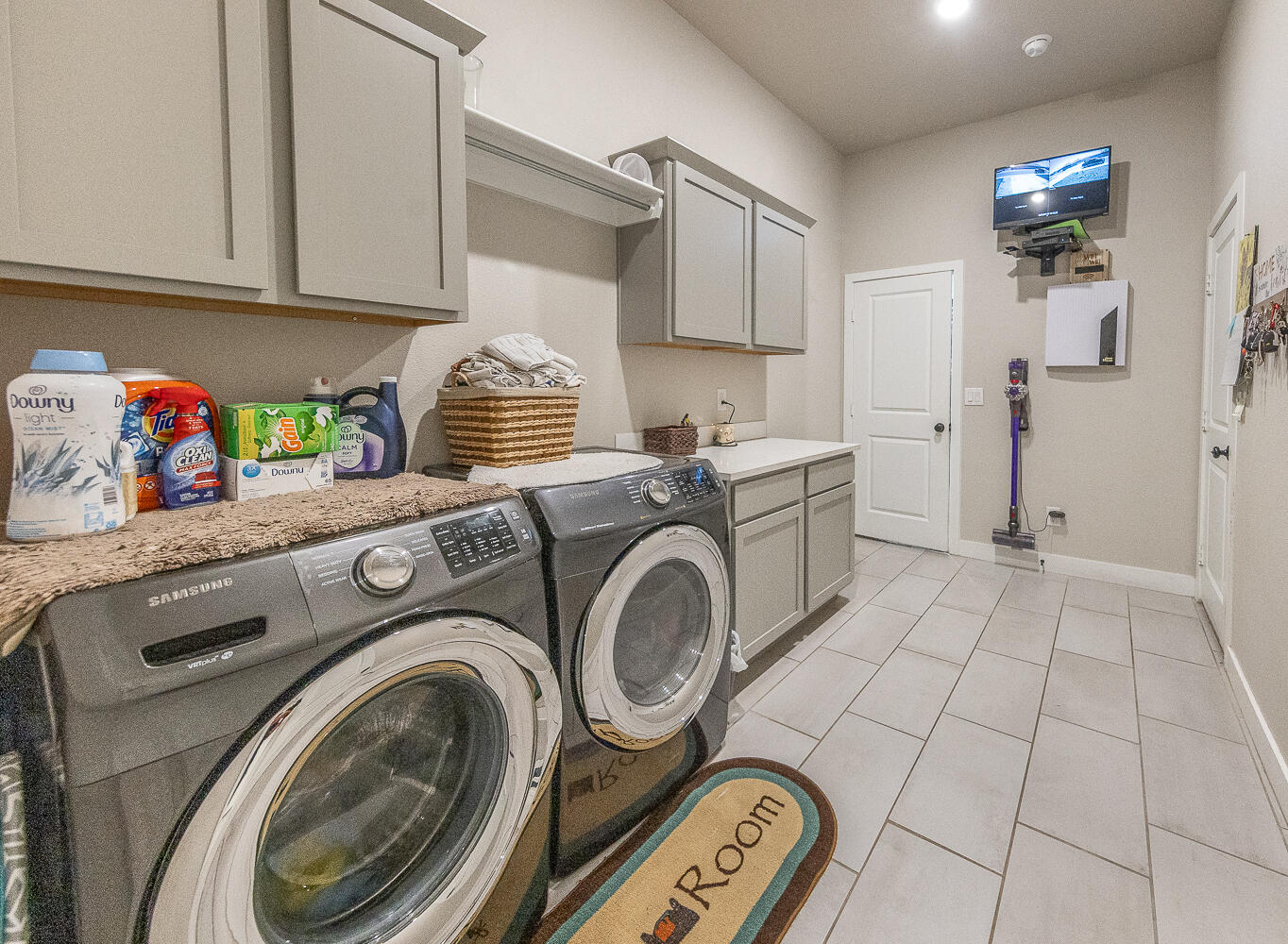 7334 29th Street Lubbock, TX 79407 - Photo 22 of 31 a utility room with sink dryer and washer