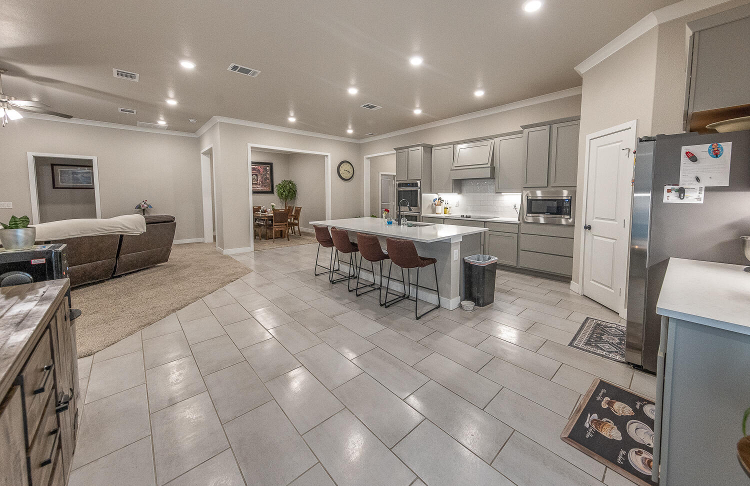 7334 29th Street Lubbock, TX 79407 - Photo 24 of 31 a large kitchen with a table and chairs