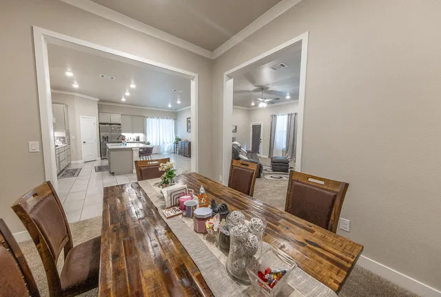 a large kitchen with kitchen island a sink a counter space and stainless steel appliances