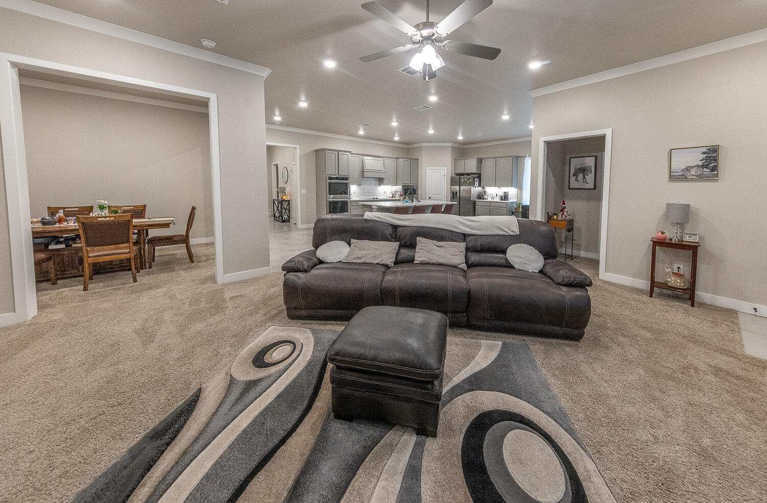 7334 29th Street Lubbock, TX 79407 - Photo 5 of 31 a living room with furniture and a view of kitchen