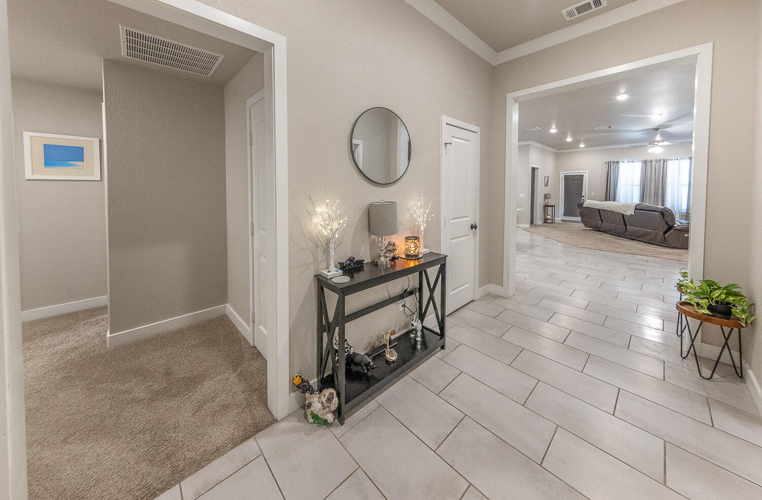 7334 29th Street Lubbock, TX 79407 - Photo 6 of 31 a room with lots of white furniture and glass door