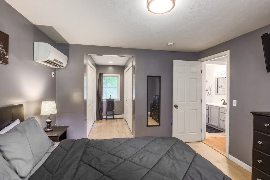 10 Bernie Road Holland, MA 01521 - Photo 11 of 29 a bedroom with a bed and a lamp on dresser