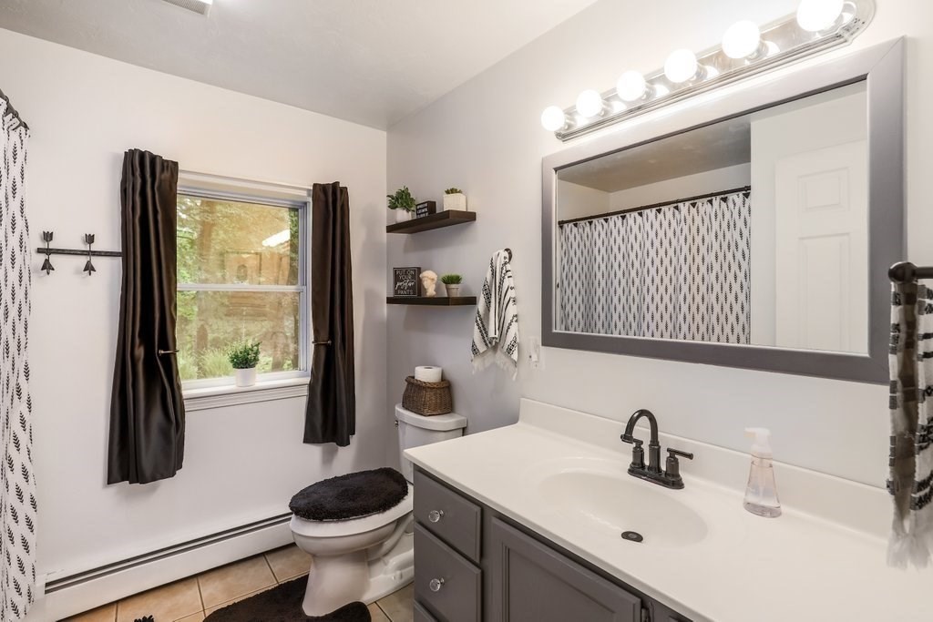 10 Bernie Road Holland, MA 01521 - Photo 13 of 29 a bathroom with a sink and a mirror