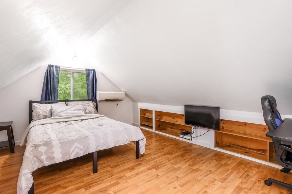 10 Bernie Road Holland, MA 01521 - Photo 16 of 29 a bedroom with furniture and a wooden floor