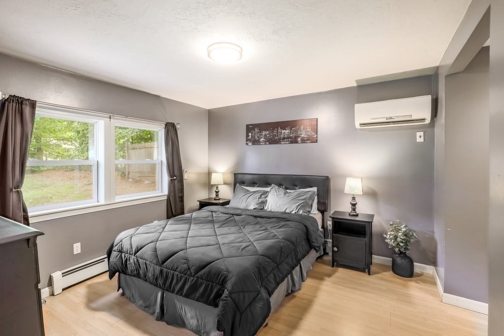 10 Bernie Road Holland, MA 01521 - Photo 10 of 29 a bedroom with a bed and a large window