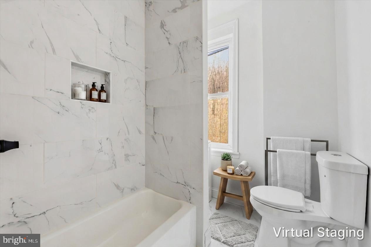 2046 South Norwood Street, Unit 2 Philadelphia, PA 19145 - Photo 17 of 17 Modern elegance in a serene bathroom.