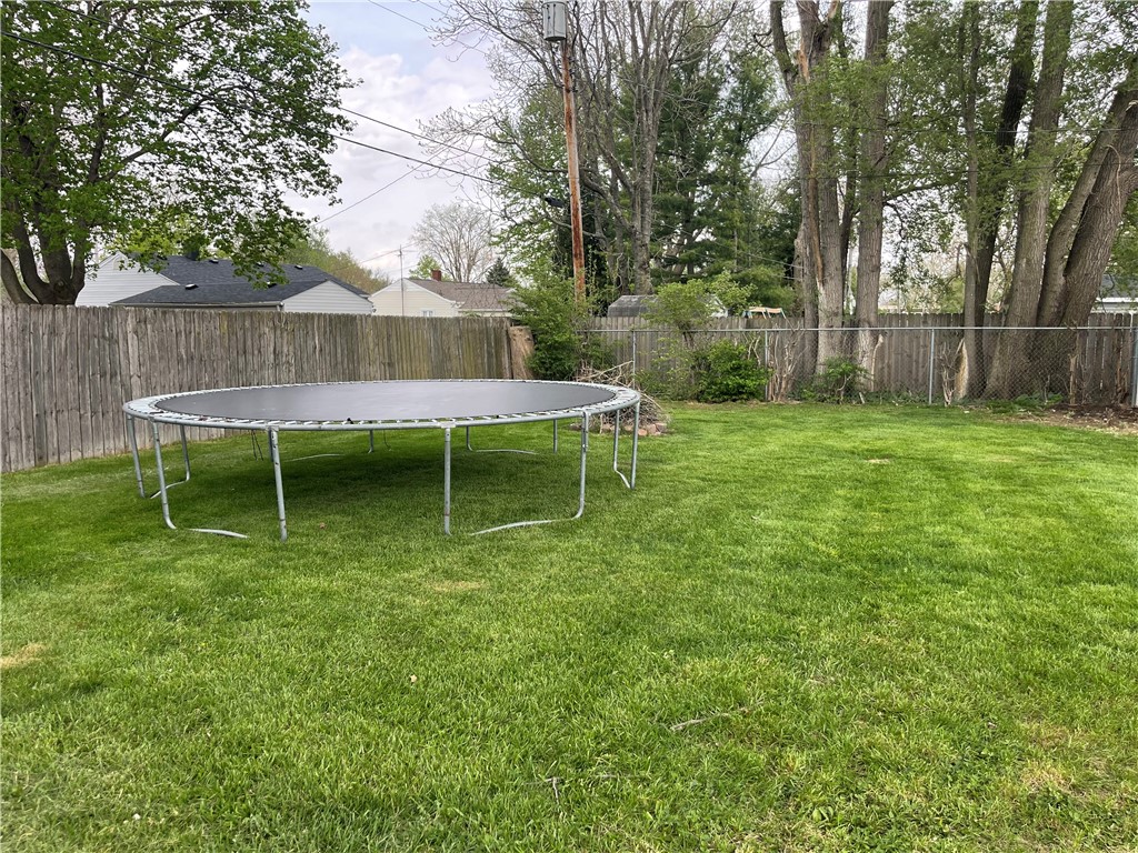 1361 Sussex Road Troy, OH 45373 - Photo 5 of 25 This spacious backyard provides ample room for outdoor activities and relaxation.