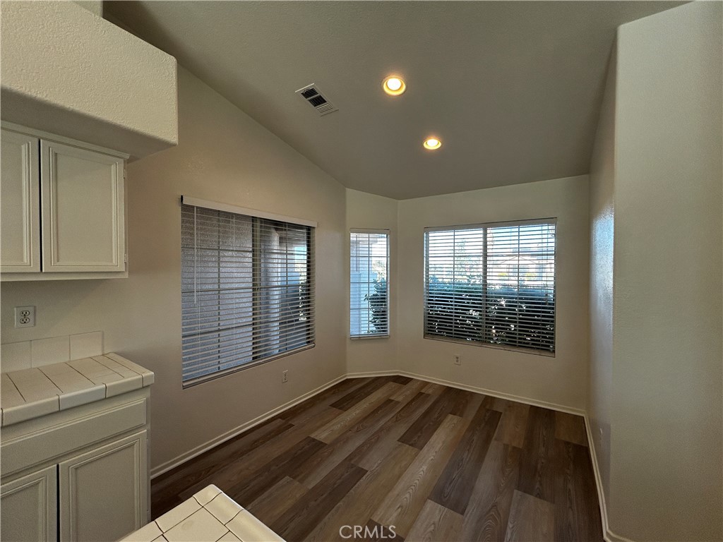 36996 Pomerol Loop Winchester, CA 92596 - Photo 3 of 5 a view of empty room with wooden floor and fan