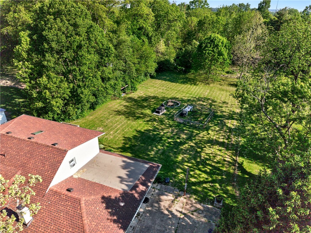 2684 Arthur Road Springfield, OH 45502 - Photo 61 of 69 This expansive backyard offers ample green space and mature trees.