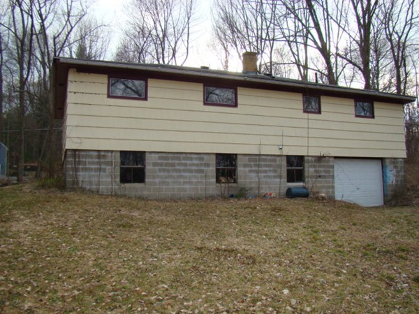 255 Putnam Hill Road Sutton, MA 01590 - Photo 2 of 6 a view of a house with a yard