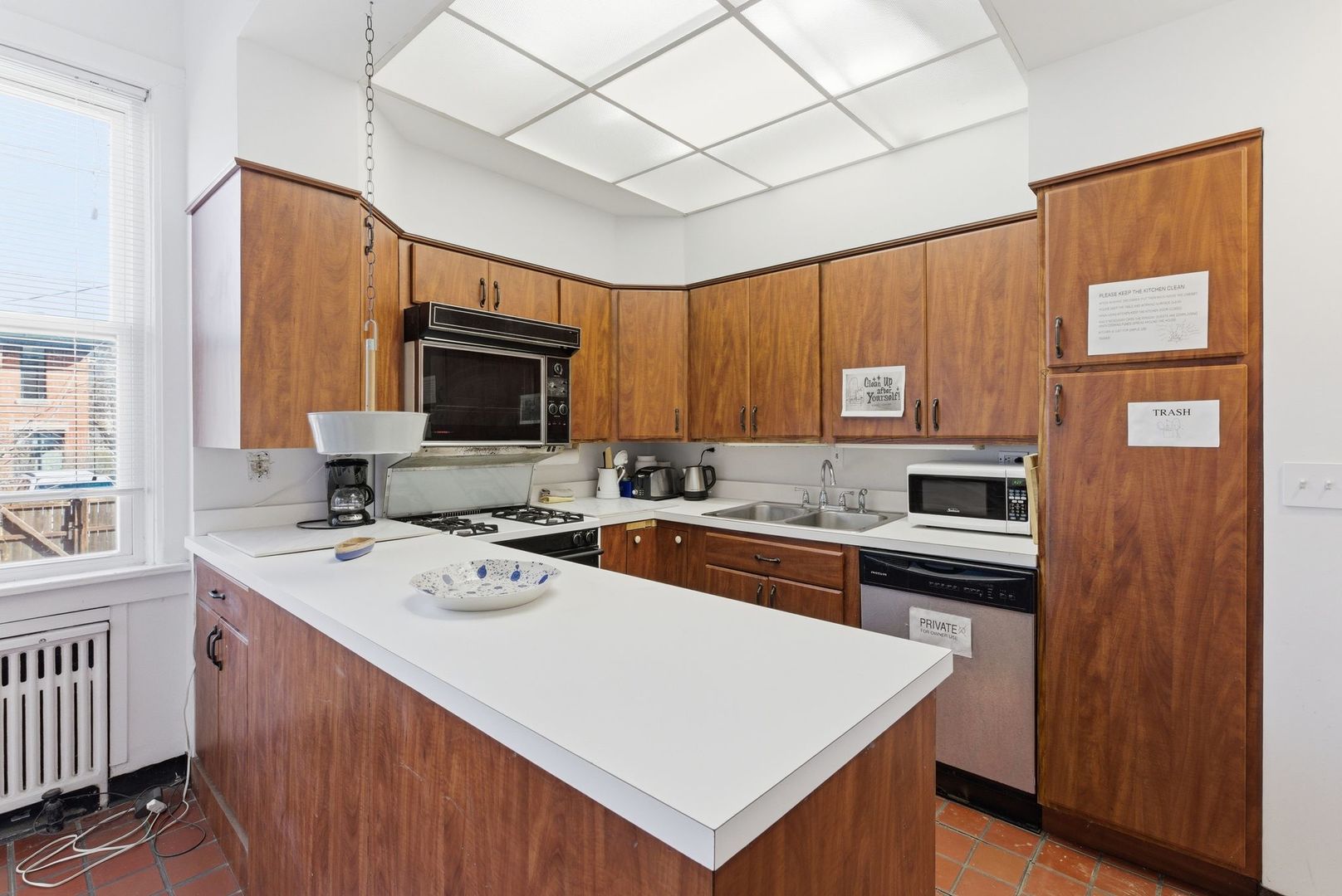 2001 Orrington Avenue, Unit 2001 Evanston, IL 60201 - Photo 15 of 50 a kitchen with stainless steel appliances a stove refrigerator sink and cabinets