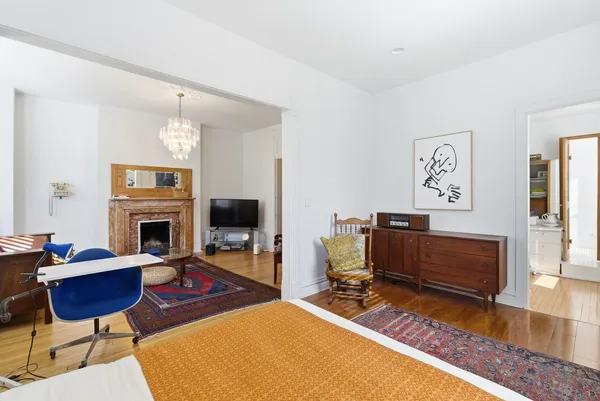 a view of a livingroom with furniture and a fireplace