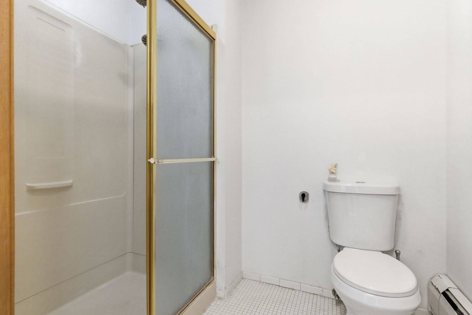 2001 Orrington Avenue, Unit 2001 Evanston, IL 60201 - Photo 22 of 50 a white toilet sitting next to a shower