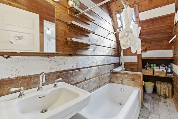 a bathroom with a sink and a bathtub