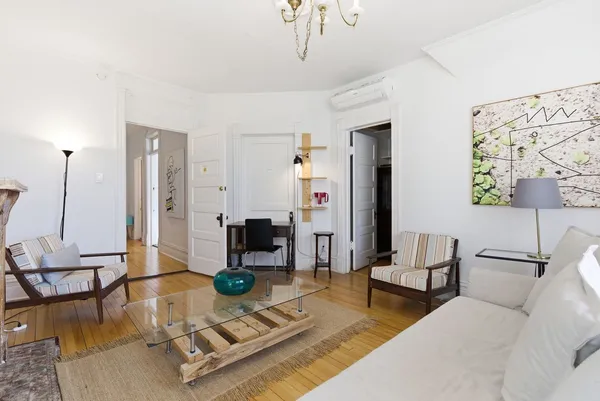 a living room with furniture and a table
