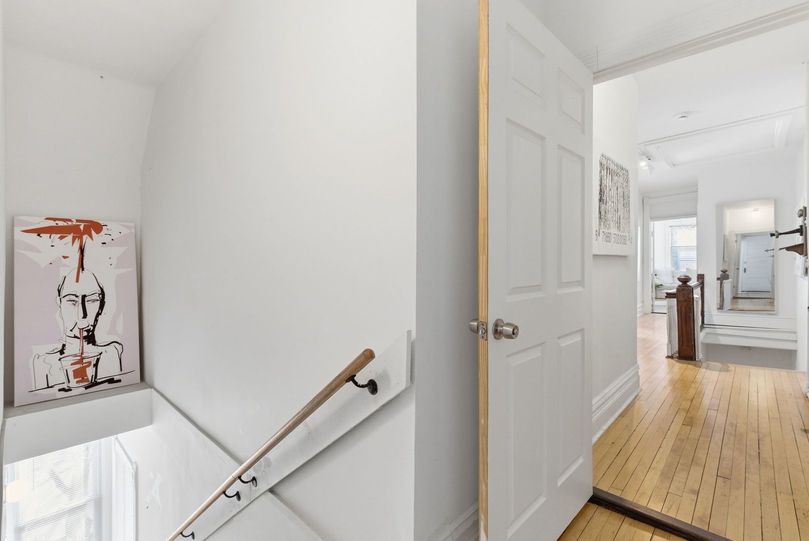 2001 Orrington Avenue, Unit 2001 Evanston, IL 60201 - Photo 45 of 50 a view of a hallway with wooden floor and living room