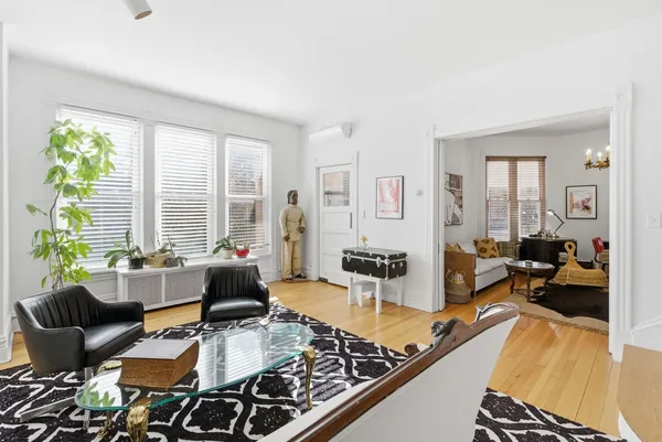 a living room with furniture and a large window