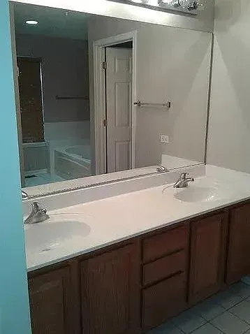 a view of empty room with a fireplace