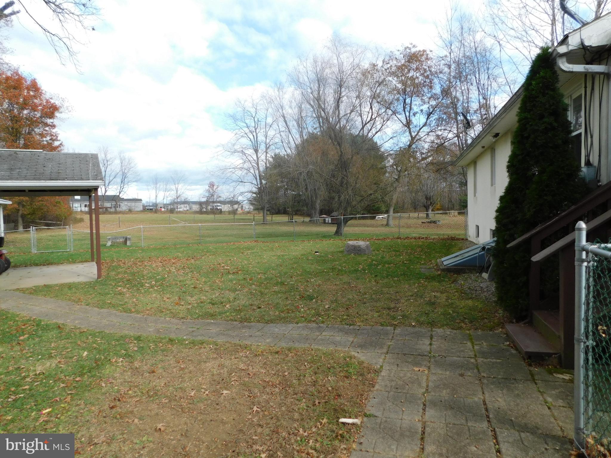 115 Limekiln Road Bechtelsville, PA 19505 - Photo 12 of 17 a view of a field with an trees