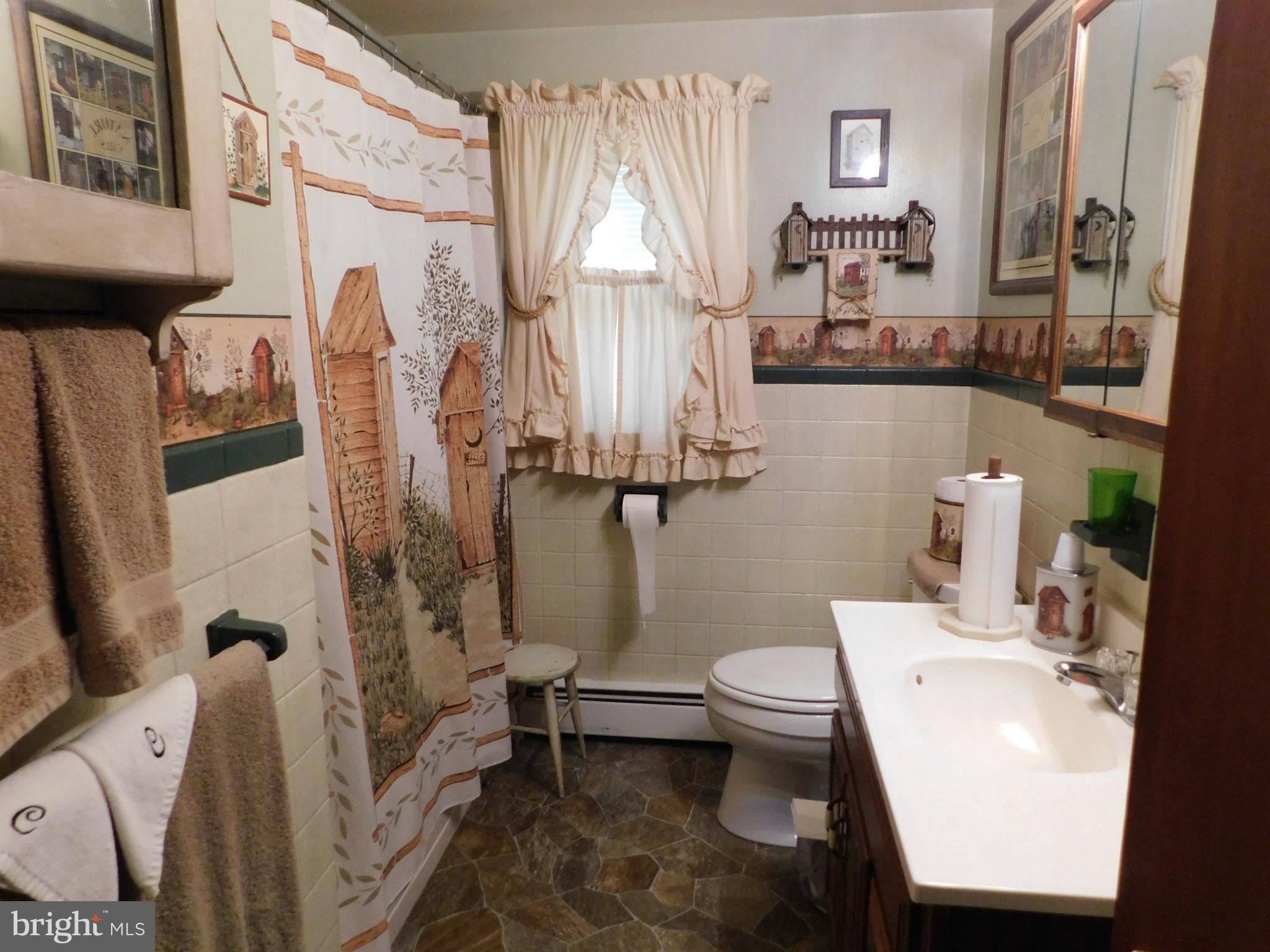 115 Limekiln Road Bechtelsville, PA 19505 - Photo 4 of 17 a bathroom with a sink toilet and shower
