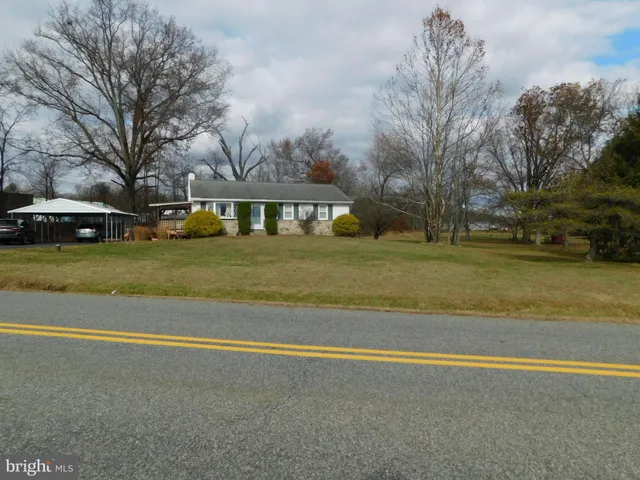 a view of a swimming pool with an outdoor space and seating area