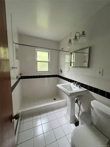 a bathroom with a tub and a sink