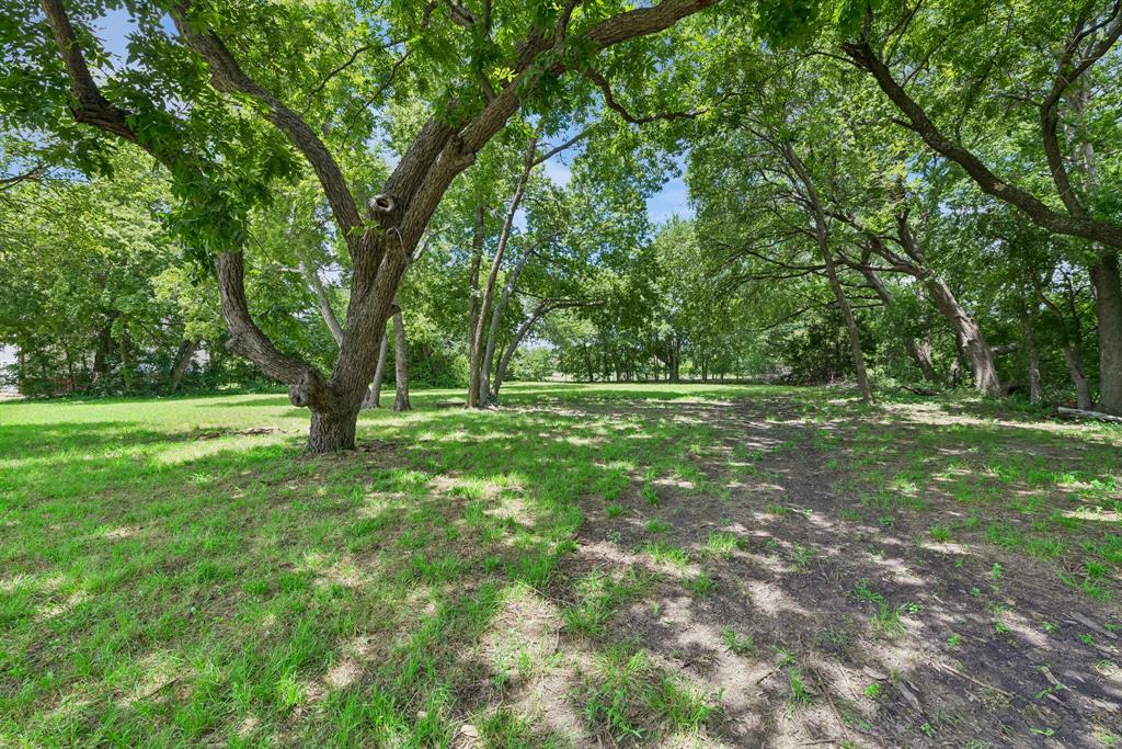 286 West Forest Grove Road Lucas, TX 75002 - Photo 16 of 23 a view of outdoor space with deck and yard