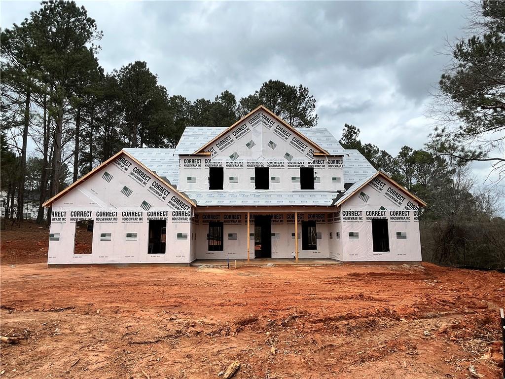1389 Lee Peters Road Loganville, GA 30052 - Photo 1 of 1 a front view of a house with a yard