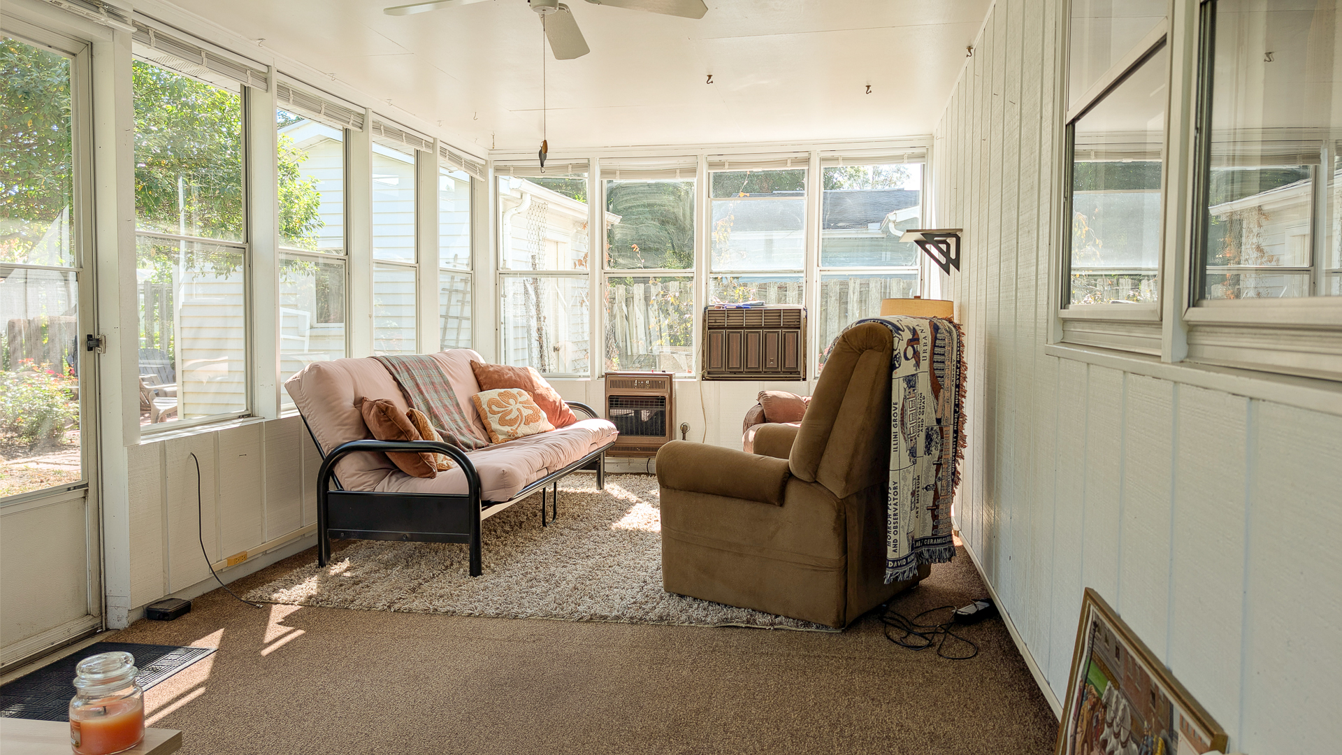 502 South Main Street St. Joseph, IL 61873 - Photo 22 of 25 a living room with furniture and a floor to ceiling window