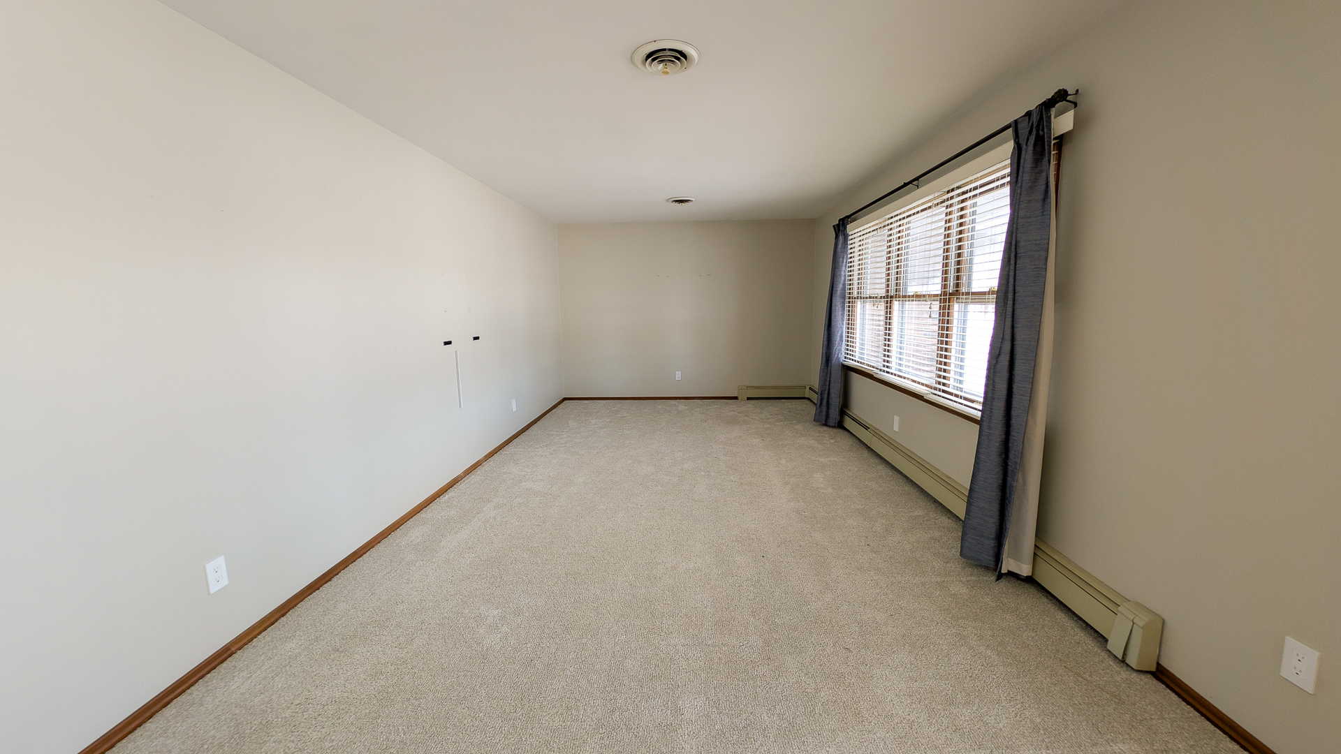 502 South Main Street St. Joseph, IL 61873 - Photo 4 of 25 a view of an empty room with a window