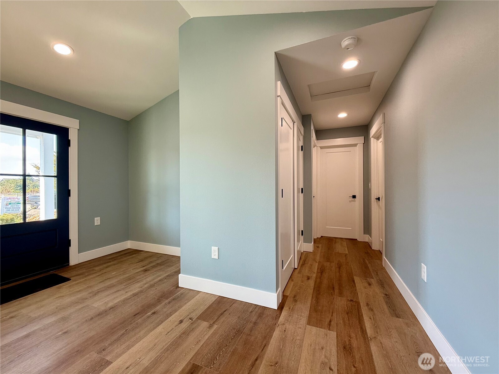 716 Reporter Court Southwest Ocean Shores, WA 98569 - Photo 20 of 36 wooden floor in an empty room with a window