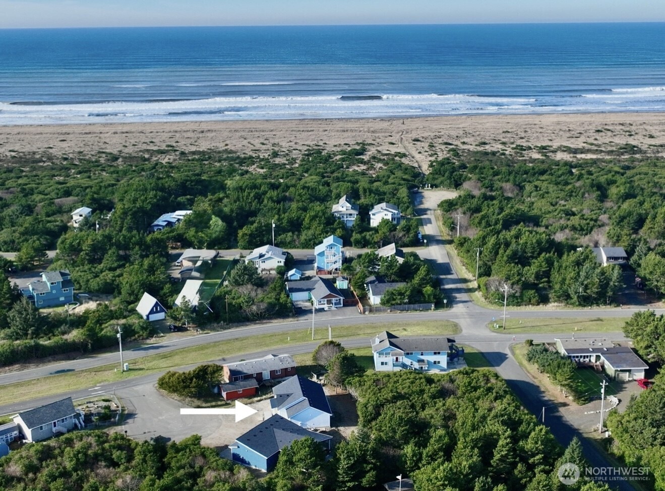 716 Reporter Court Southwest Ocean Shores, WA 98569 - Photo 2 of 36 a view of a lake with beach and outdoor space