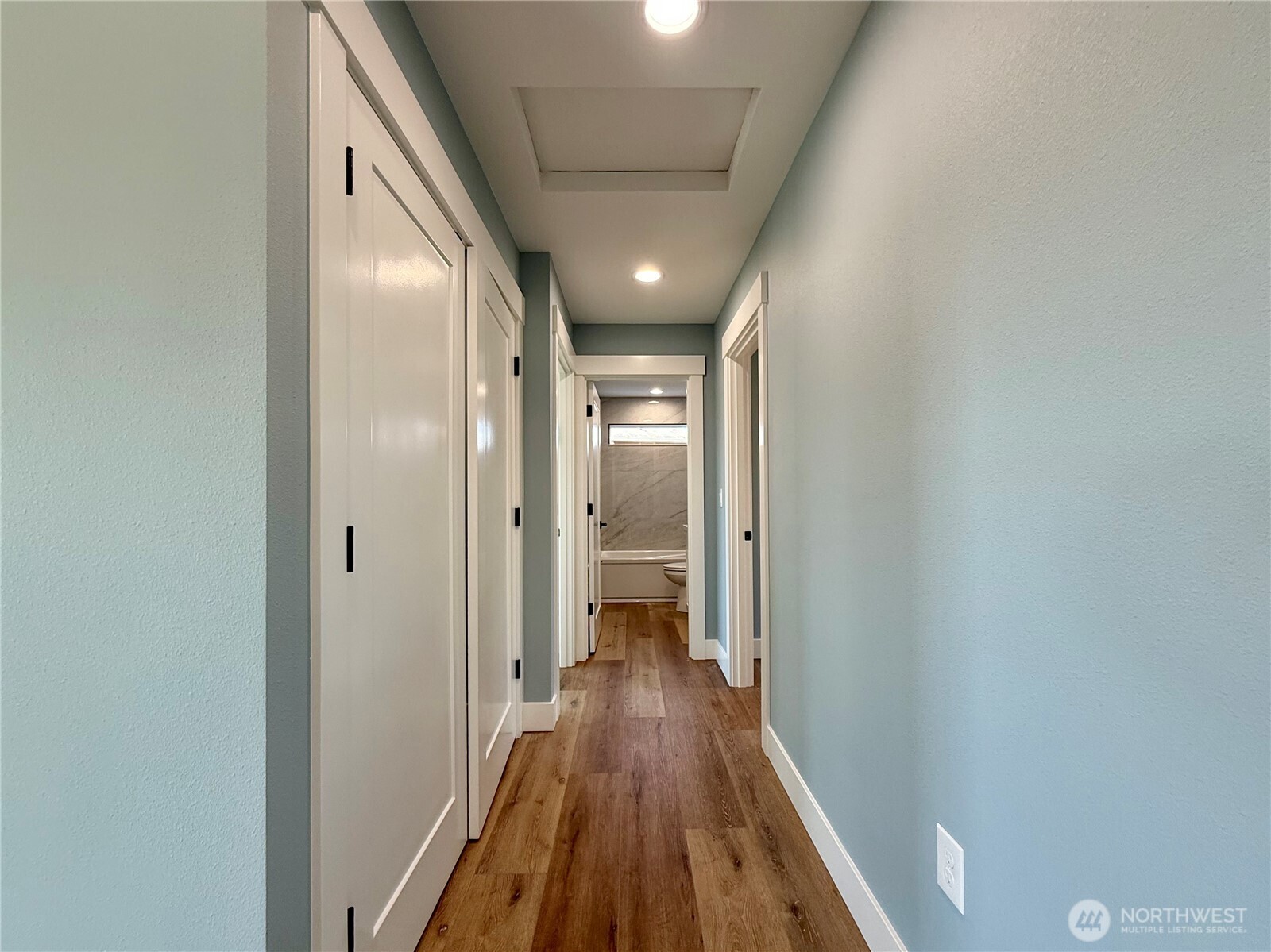 716 Reporter Court Southwest Ocean Shores, WA 98569 - Photo 21 of 36 a view of a hallway with wooden floor