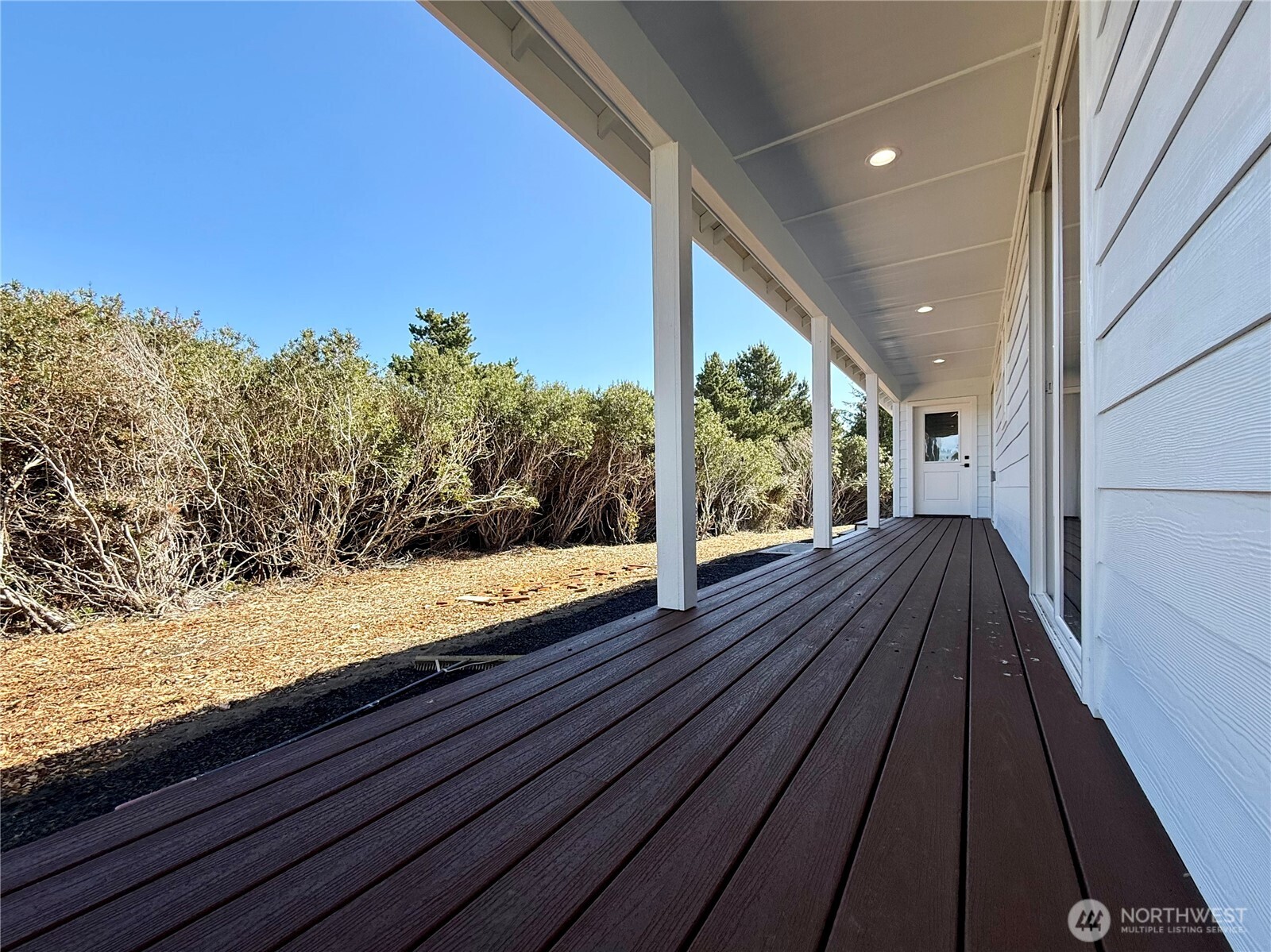 716 Reporter Court Southwest Ocean Shores, WA 98569 - Photo 25 of 36 a view of balcony with wooden floor and fence