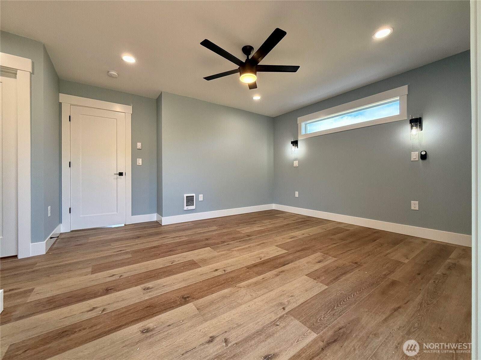 716 Reporter Court Southwest Ocean Shores, WA 98569 - Photo 27 of 36 an empty room with closet and ceiling fan