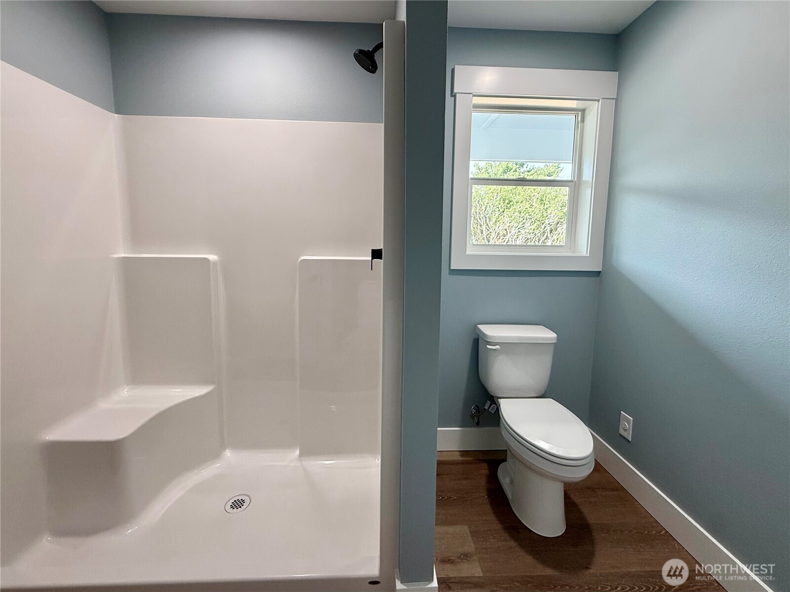716 Reporter Court Southwest Ocean Shores, WA 98569 - Photo 30 of 36 a white toilet sitting next to a bathroom sink