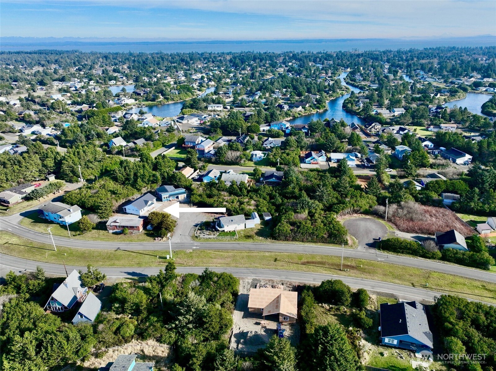 716 Reporter Court Southwest Ocean Shores, WA 98569 - Photo 36 of 36 an aerial view of a house with a garden