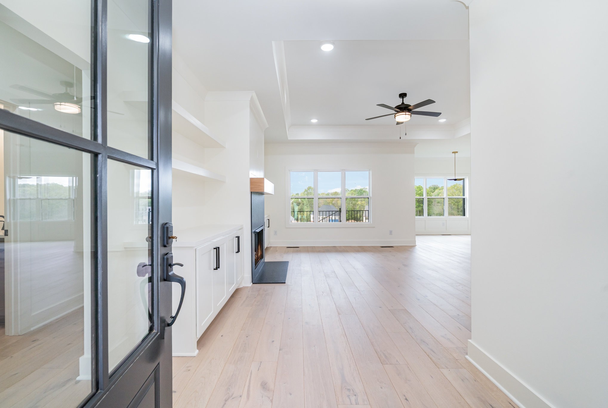 115 Crenshaw Road Hartsville, TN 37074 - Photo 4 of 40 a view of a hallway with wooden floor and a living room