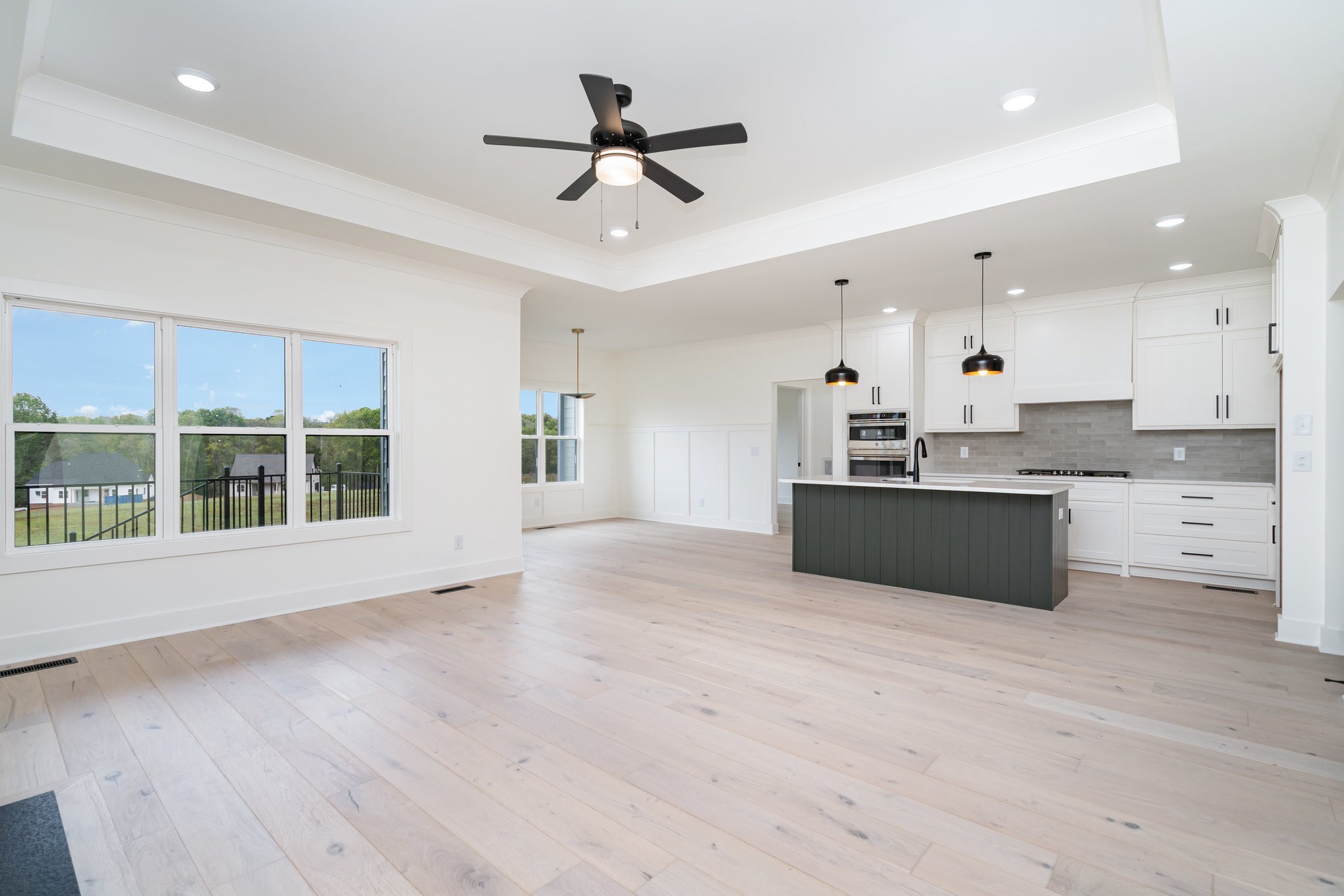 115 Crenshaw Road Hartsville, TN 37074 - Photo 6 of 40 a large kitchen with stainless steel appliances kitchen island a large counter top and a wooden floors