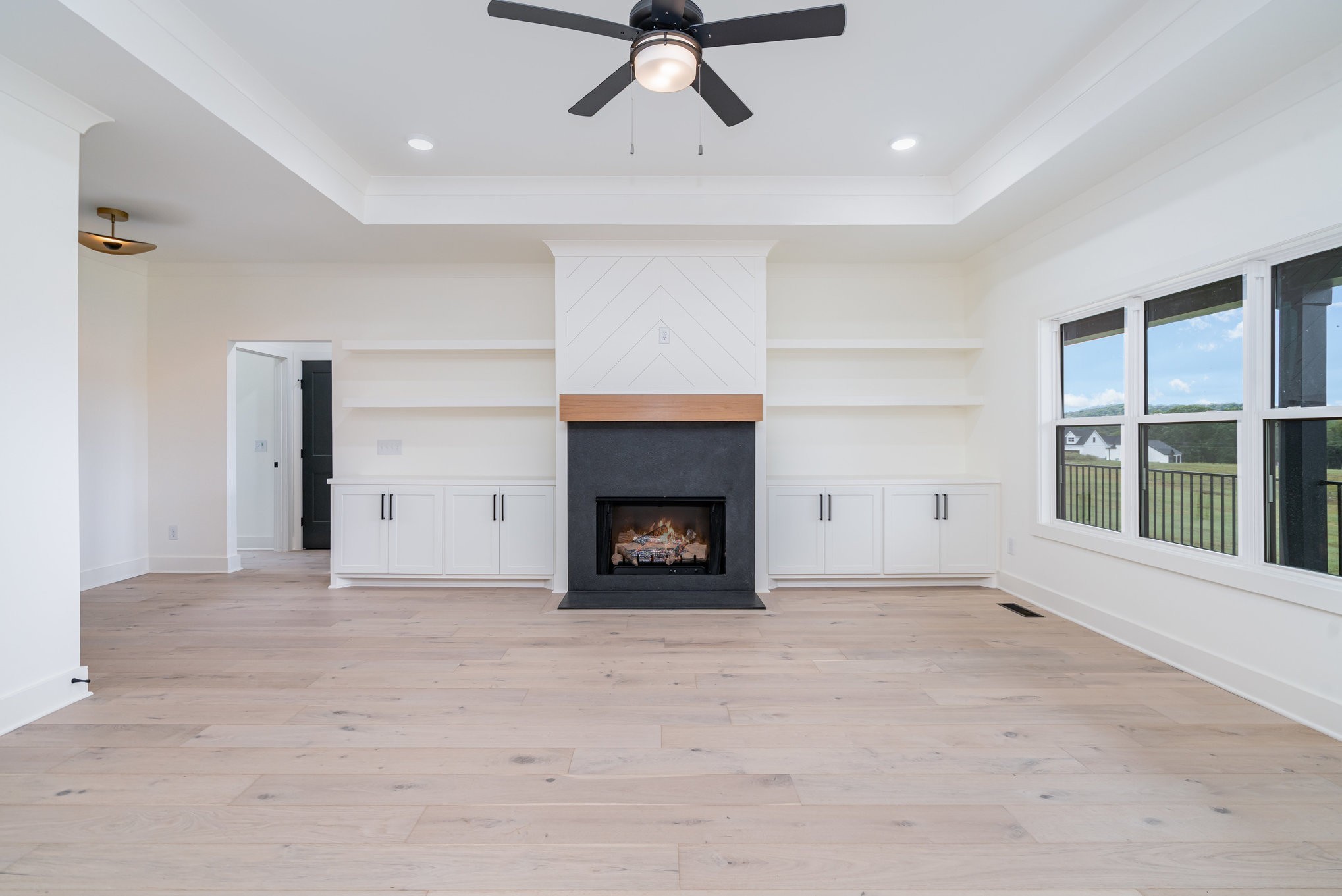 115 Crenshaw Road Hartsville, TN 37074 - Photo 7 of 40 a view of an empty room with a window and fireplace