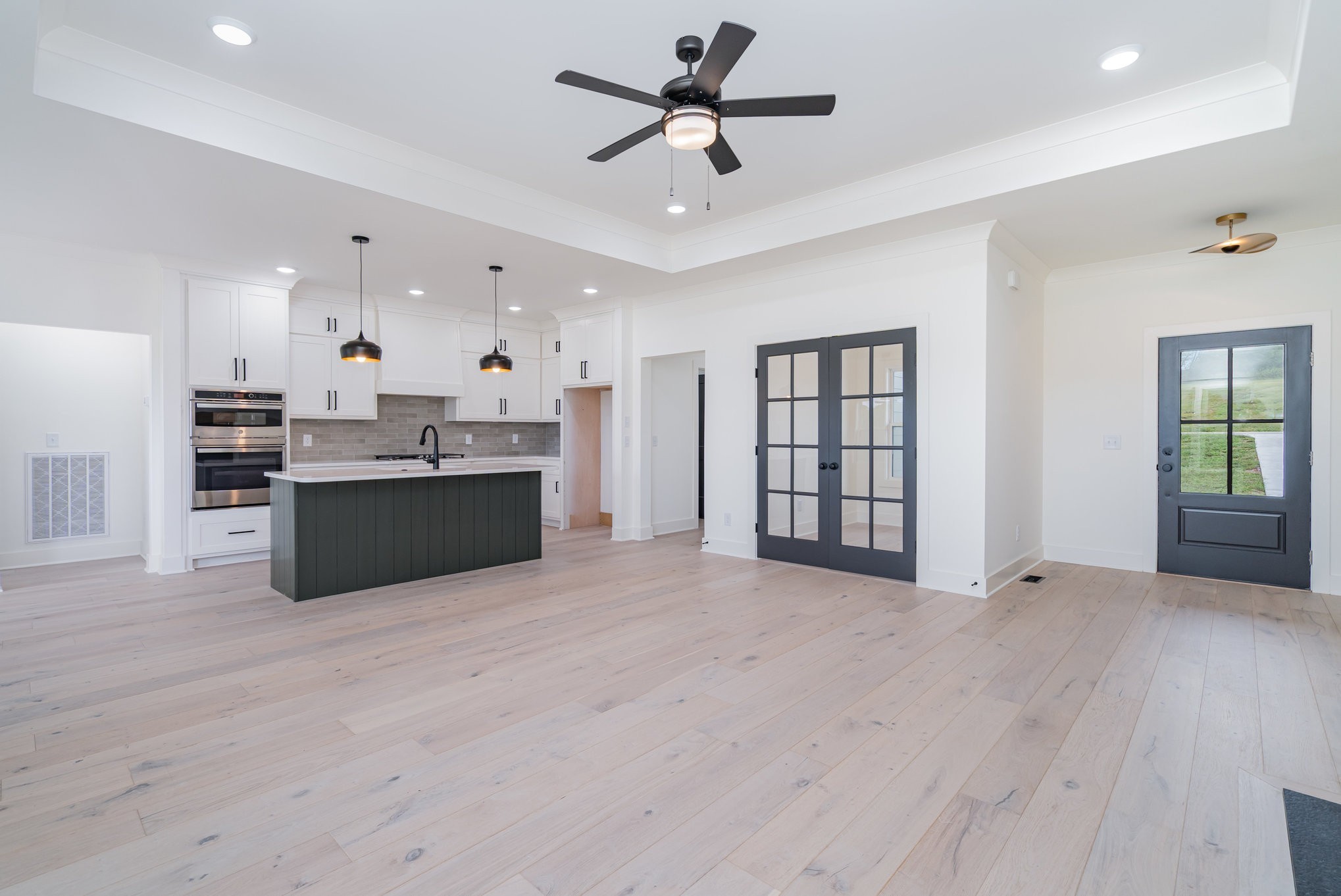 115 Crenshaw Road Hartsville, TN 37074 - Photo 7 of 40 a view of an empty room with window and wooden floor