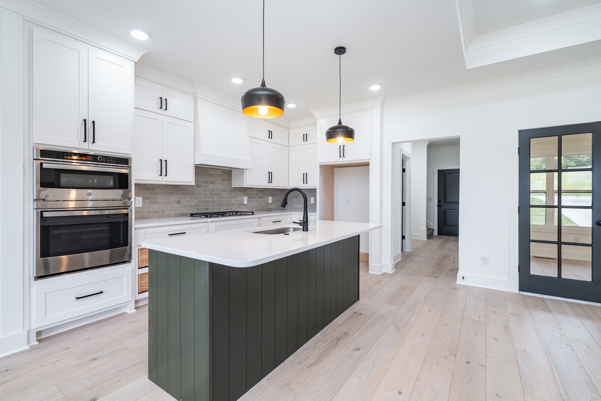 115 Crenshaw Road Hartsville, TN 37074 - Photo 8 of 40 a kitchen with a sink stainless steel appliances and chandelier