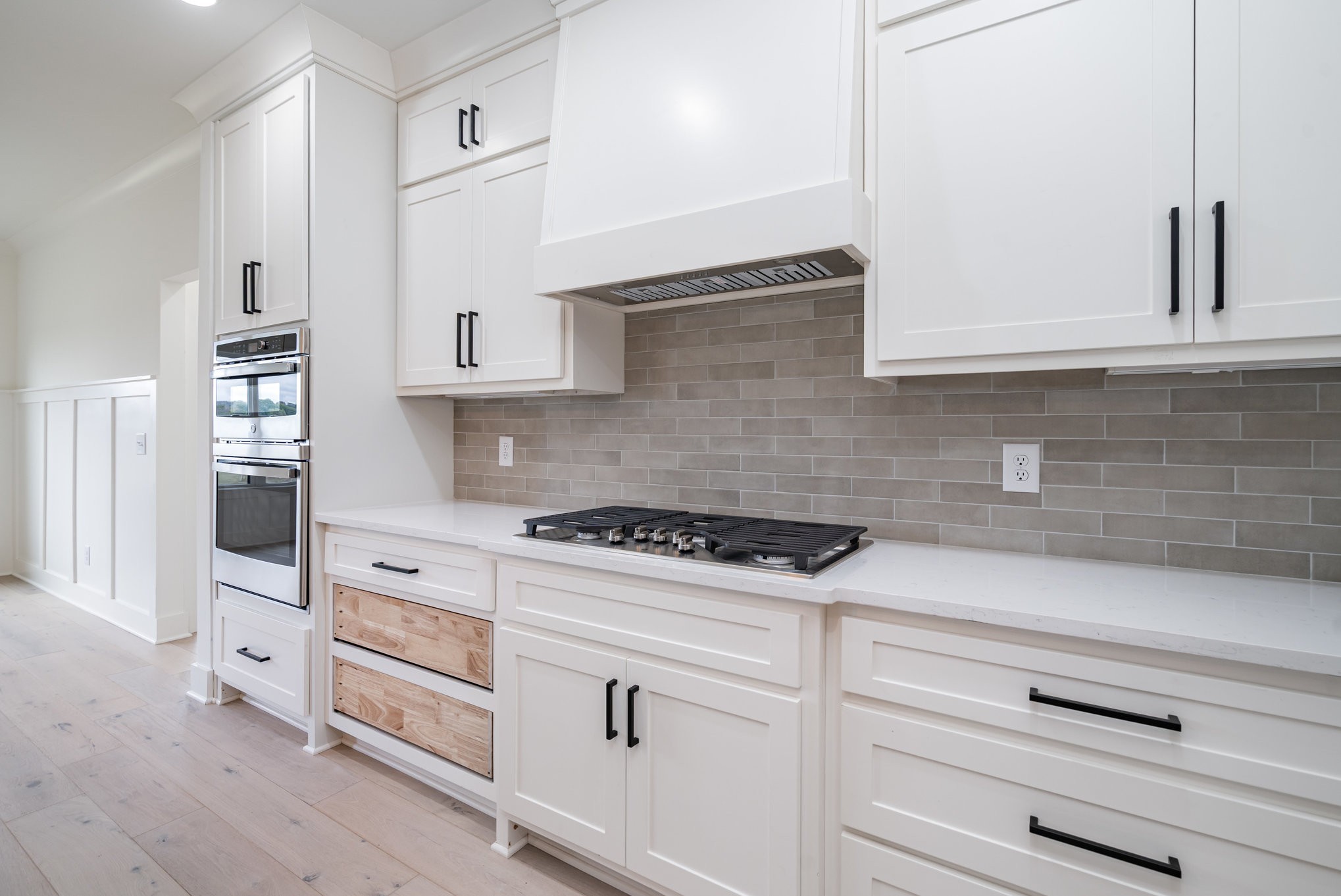 115 Crenshaw Road Hartsville, TN 37074 - Photo 10 of 40 a kitchen with white cabinets and appliances